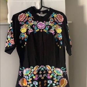 Black skater dress with floral embroidery